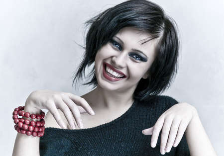 smiling woman portrait with white teeth and red lipstickの写真素材