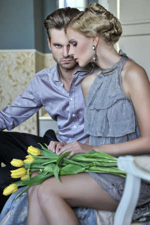 Handsome couple in fashionable roomの写真素材