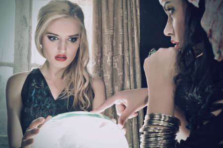 Fortune teller with her crystal ballの写真素材