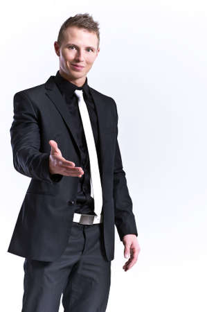 A business man with an open hand ready to seal a dealの写真素材