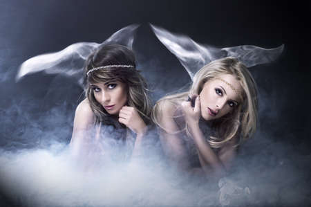 Two women like sirenの写真素材