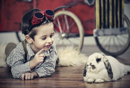 Smiling boy with rabbitの写真素材