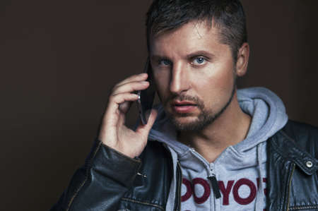 Handsome man with phoneの写真素材