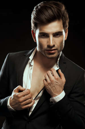 Portrait of handsome stylish man in elegant suitの写真素材