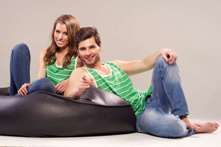 Portrait of smiling young couple at homeの写真素材