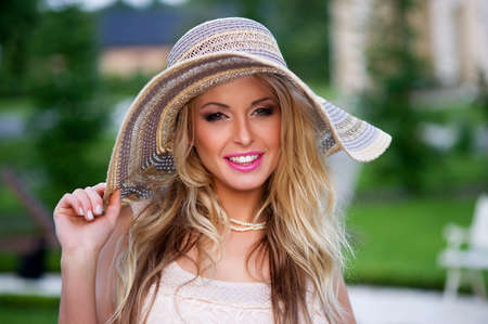 Sexy blonde woman with red lips and hatの写真素材