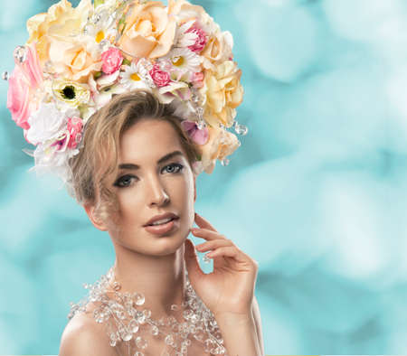 fashion model with large hairstyle and flowers in her hair.の写真素材