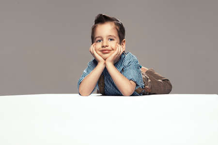 Little boy lying on the floorの写真素材