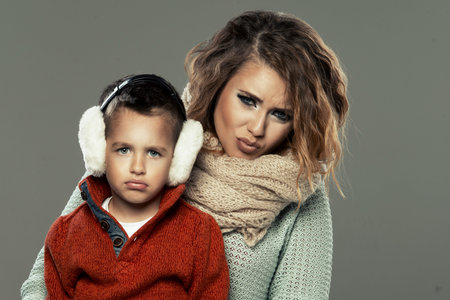 Portrait of a young woman with her son