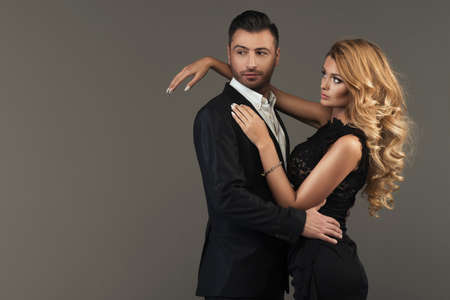 portrait of a young fashion couple looking into the cameraの写真素材