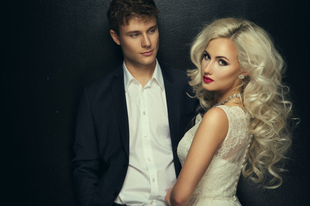Bride and groom wedding photo taken in the studio on a black backgroundの写真素材