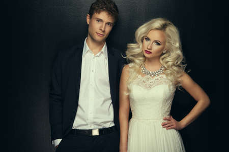 Bride and groom wedding photo taken in the studio on a black backgroundの写真素材