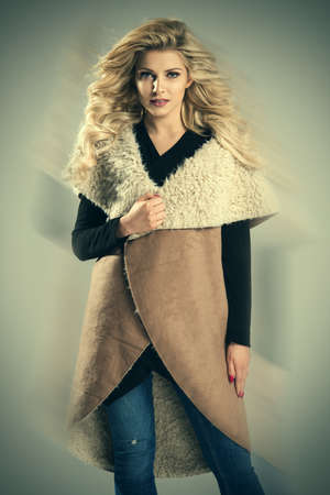 Beautiful elegant woman in autumn stylizationの写真素材