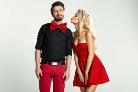 Young fanny couple posing in studioの写真素材