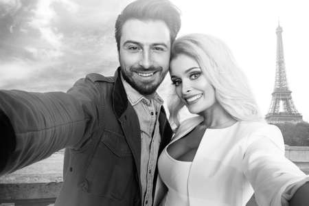 Couple in Paris taking picturesの写真素材