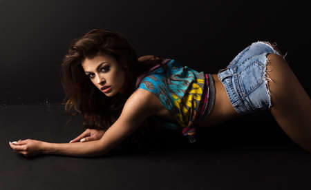 Beautiful athletic woman showing musclesの写真素材