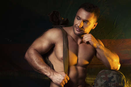 Muscular man come back from armyの写真素材