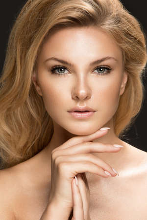 Glamour portrait of beautiful woman model. Summer glow on skinの写真素材