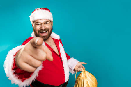 Happy Santa Claus pointing on you, concept christmasの写真素材