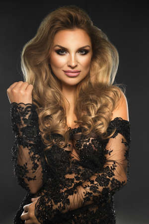Portrait of beauty blonde woman in dark roomの写真素材