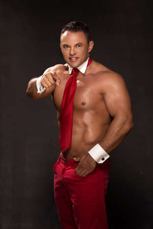 Young elegant handsome athlete with a red tieの写真素材