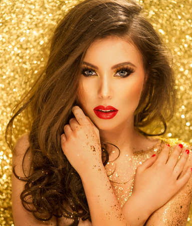 Magic Girl Portrait in Gold. Golden Makeupの写真素材