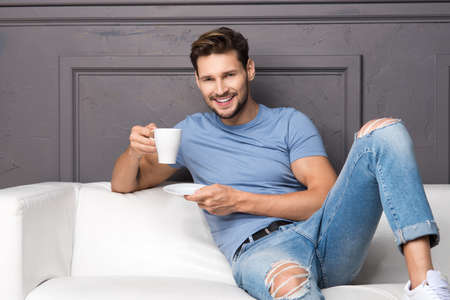 Handsome man with cup of coffeeの写真素材
