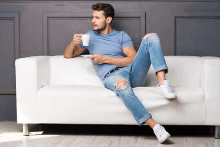 Handsome man with cup of coffeeの写真素材