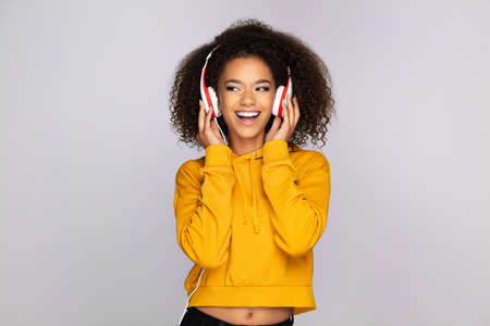 Young woman enjoying musicの写真素材