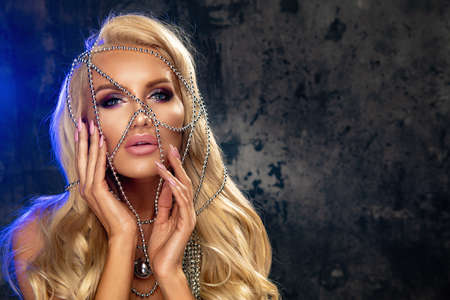 Beauty blond woman with silver jewelryの写真素材