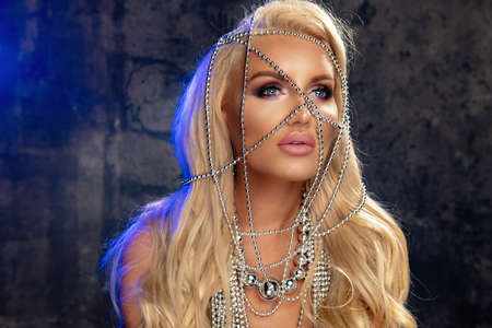 Beauty blond woman with silver jewelryの写真素材