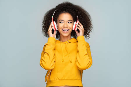 Young woman enjoying musicの写真素材