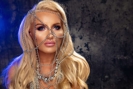 Beauty blond woman with silver jewelryの写真素材