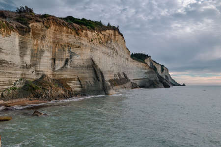 Logas Beach with azure water and amazing rocky cliff in Peroulades, Ionian island Corfu, Greece, Europe.の写真素材