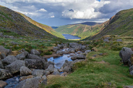 Upper Lake trail on top of the mountain in the valley of Glendalough, Wicklow Mountains, Ireland. Summer day.の写真素材
