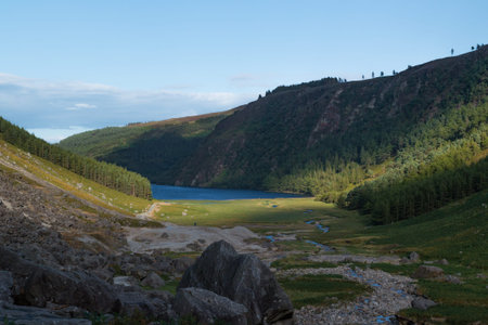 Upper Lake trail on top of the mountain in the valley of Glendalough, Wicklow Mountains, Ireland. Summer day.の写真素材
