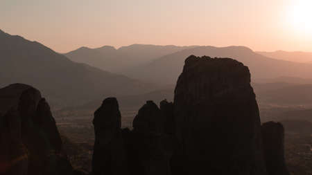 Meteora, a vast complex of giant rock pillars with monasteries. Sunset in Greece.の写真素材