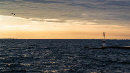 Panoramic sea view during sunset at Thessaloniki harbor, Greece.の写真素材