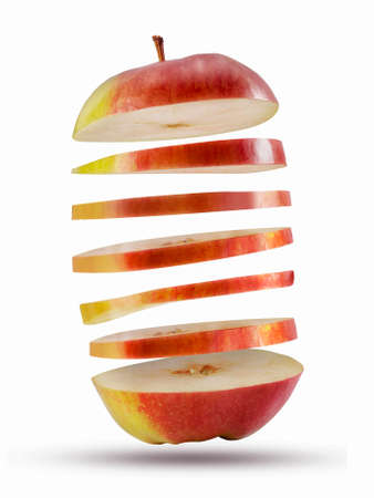 Fresh red sliced apple flying in the air.の写真素材