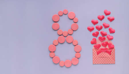 Figure eight of pink buttons, envelope with hearts. 8 March, International Women's Day.の写真素材