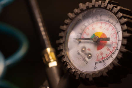 Pressure gauge close up in workshop. Selective focus.の写真素材