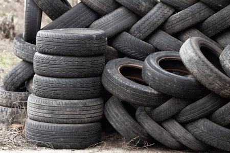 A bunch of dump tires from used cars. Environmental pollution. Old tires.の写真素材