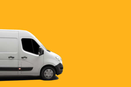 Side view of white delivery truck on yellow background. Delivery conceptの写真素材