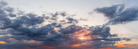 Panorama of a dramatic sky at sunset. Beautiful cloudscapeの写真素材