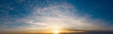 Dramatic sky with beautiful clouds at sunset in the evening. Beautiful cloudscape.