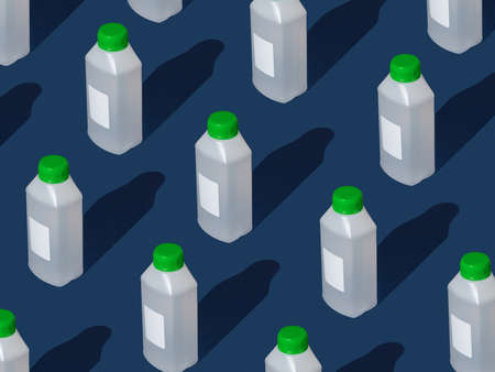 Creative pattern of large bottle of sanitizer on blue background. Hygiene products for hand disinfection.の写真素材