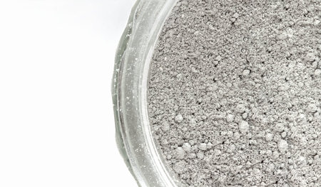 Tooth powder with activated charcoal in a jar on white background. Natural product for personal...