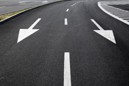 Arrow signs as road markings on a streetの写真素材