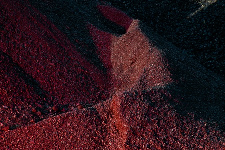 Heaps of coal in the red lightの写真素材