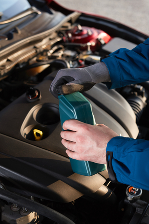 Checking the oil level in a modern carの写真素材